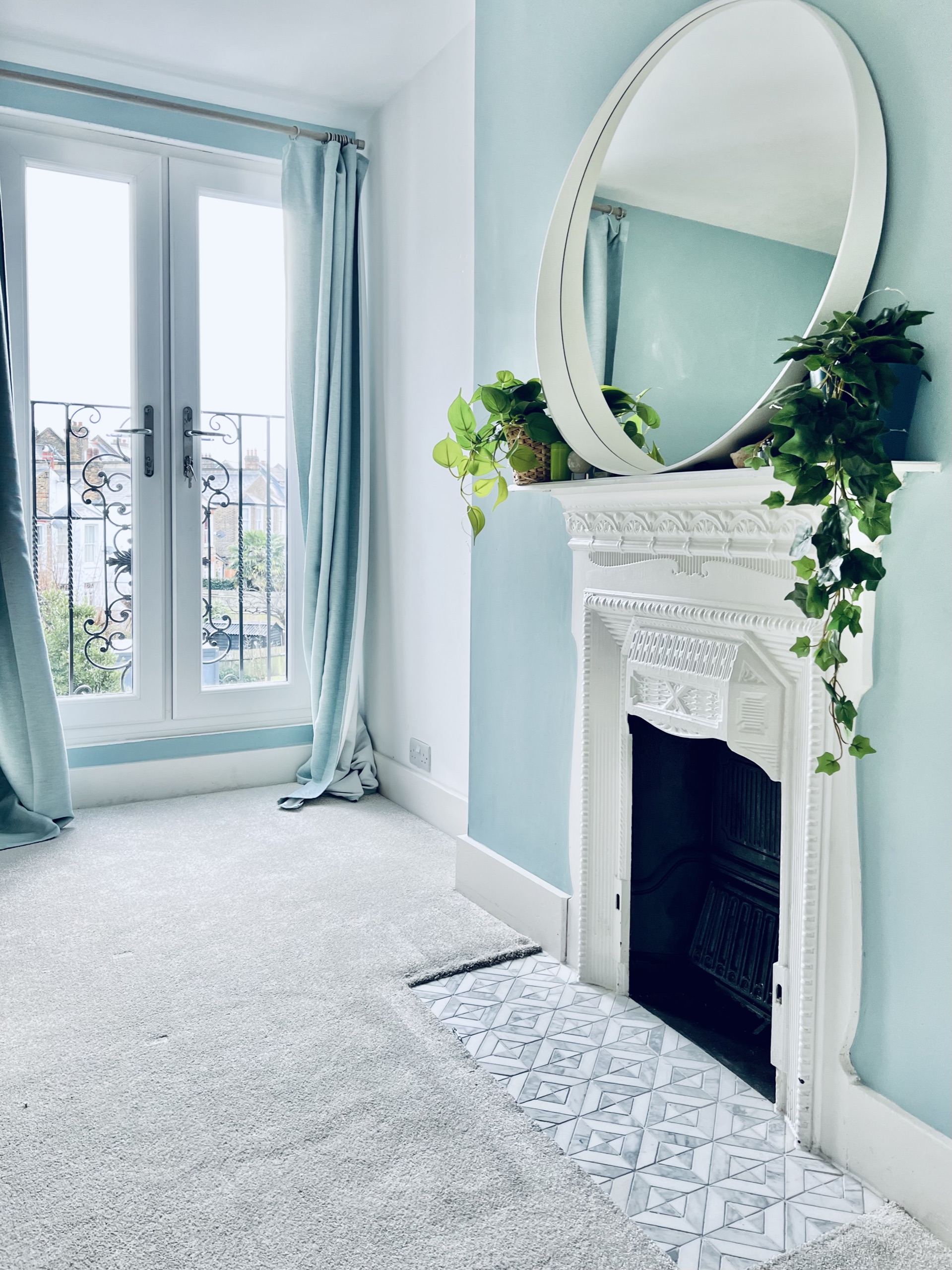 Mirror over a fireplace